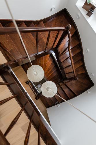 an overhead view of a wooden spiral staircase with umbrellas at Boutique Hotel HOH in Zagreb
