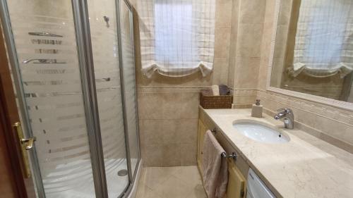 a bathroom with a shower and a sink at Viña Home in Torre del Mar