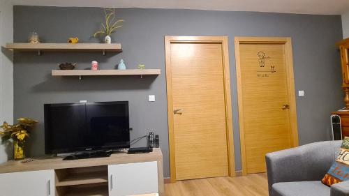 TV a/nebo společenská místnost v ubytování CASA Campelo - Playas de Pinténs - HIO - Ría de Aldán - CANGAS