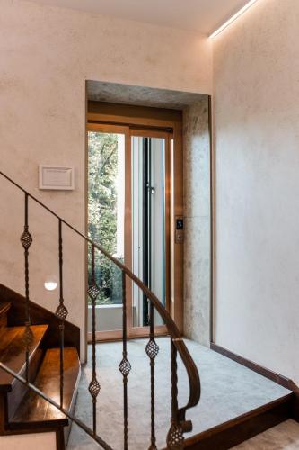 a staircase in a house with a glass door at Boutique Hotel HOH in Zagreb