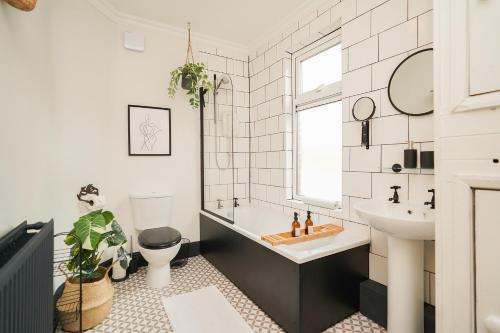 a bathroom with a sink and a toilet at Hamilton House in Sheffield