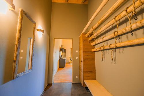 a hallway of a house with stairs and a mirror at Bienenstock in Seiffen