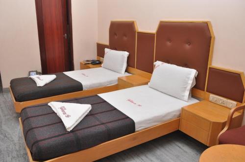 Voodi või voodid majutusasutuse Hotel Pearls toas