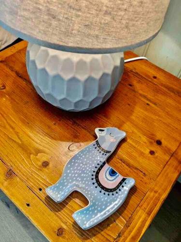 a vase sitting on top of a wooden table at Alyeska Loft - Apollo Bay studio loft apartment in Apollo Bay