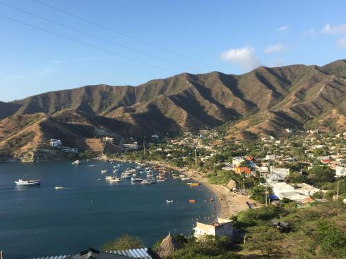a view of a beach with boats in the water at Cabañas Annapurna in Taganga