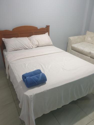 Cama ou camas em um quarto em Rooftop Inn Apartments