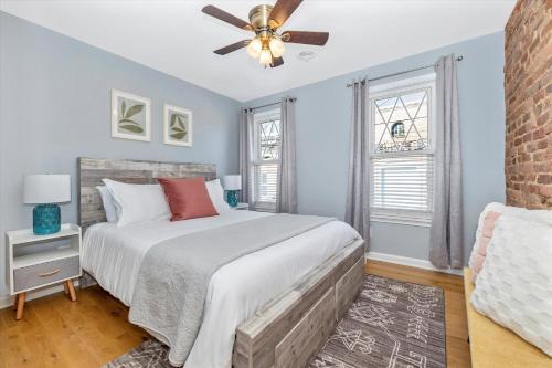 a bedroom with a bed and a ceiling fan at Cozy & Inviting Townhome in Frederick