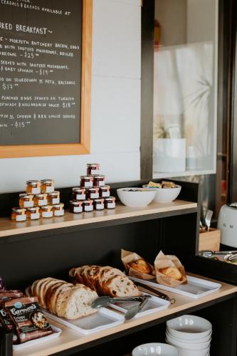 a bakery with different types of pastries on display at The Bronte Boutique Hotel in Morpeth