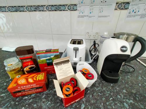 a counter top with a coffee maker and a blender at 4 Bedroom, 3 bath room home in Kingswood NSW, free WIFI Internet, free parking in Kingswood