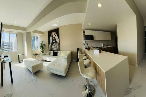 a living room with a couch and a table at The best place to live and work in Mexico City