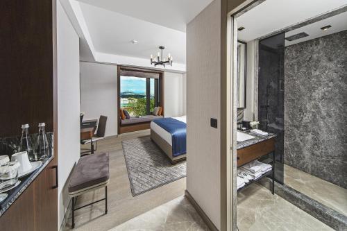 a hotel room with a bed and a bathroom at Arts Hotel Harbiye - Special Class in Istanbul