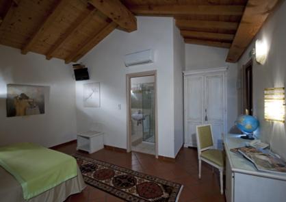 Postel nebo postele na pokoji v ubytování Resort La Mola