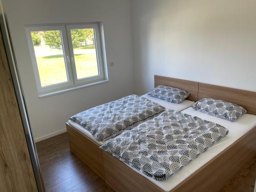 Postel nebo postele na pokoji v ubytování Penthouse Ob2