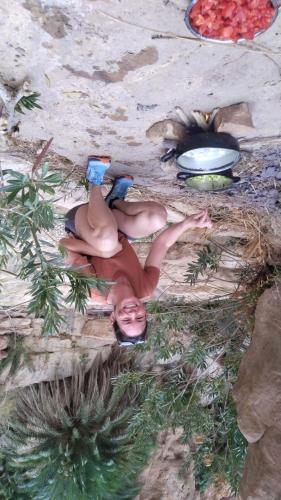 a figurine of a woman laying on the ground at - Trekking from Dana to Petra in Dana