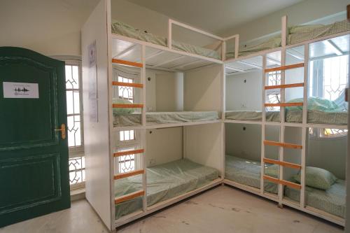 a room with a bunch of bunk beds at Destin Olympus Banjara in Hyderabad