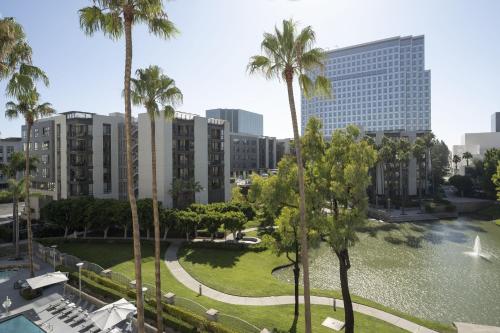 a view of a park with palm trees and buildings at Costa Mesa Marriott in Costa Mesa
