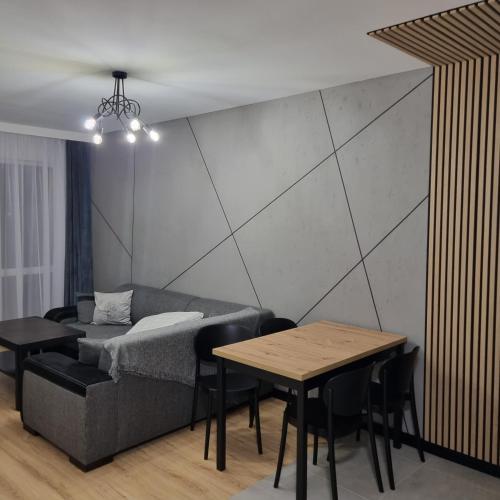 Komfortowy apartament tesisinde bir odada yatak veya yataklar