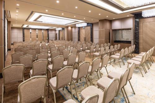 an empty room with rows of chairs and a podium at Clarion Hotel Golden Horn in Istanbul