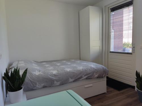 Ένα ή περισσότερα κρεβάτια σε δωμάτιο στο Cornfield