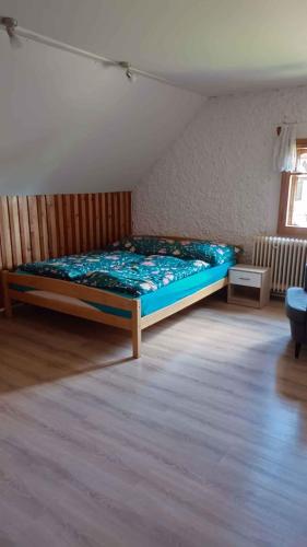 a bedroom with a bed in the middle of a room at Holiday home in Jestrabi v Krkonosich 2207 in Roudnice