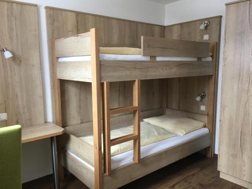 a bunk bed with four bunk beds in a room at Mönchsberghof in Kleinarl