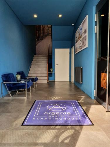 a blue room with a carpet on the floor at ARGENTA Living 16 in Künzell