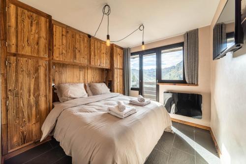 En eller flere senge i et værelse på L Aster - IMMODREAMS - Avoriaz