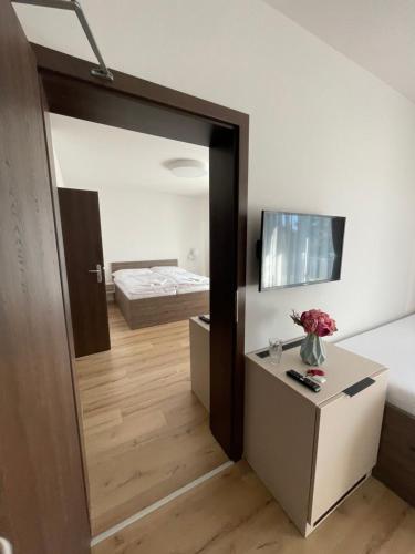 a room with a door leading to a bedroom at Zafír in Dunajská Streda