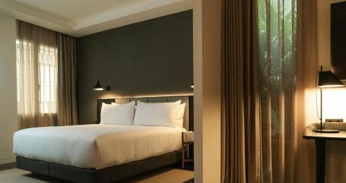 Letto o letti in una camera di Mercer Plaza Sevilla 5 GL