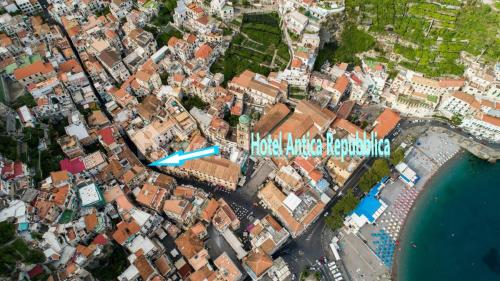an aerial view of a city with a blue arrow at ApartHotel Antica Repubblica in Amalfi center at 100mt from the sea in Amalfi