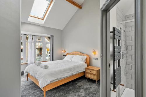 a bedroom with a bed and a window at Finest Retreats - The Lookout in Ilfracombe