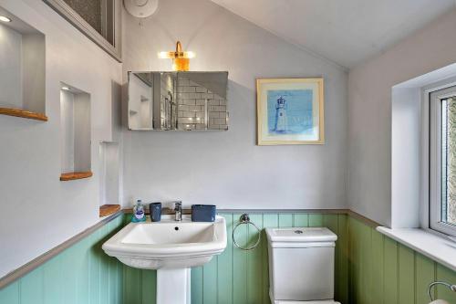 a bathroom with a sink and a toilet at Finest Retreats - The Lookout in Ilfracombe