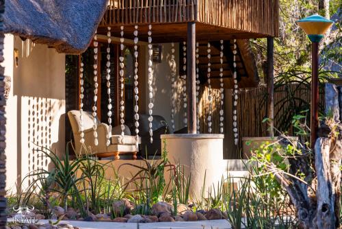 a porch with a bench and a wooden deck at Inyati Game Lodge in Sabi Sand Game Reserve