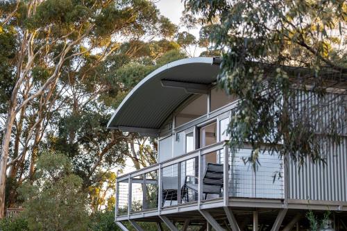 a house with a balcony with two chairs on it at The Villas - Barossa in Marananga