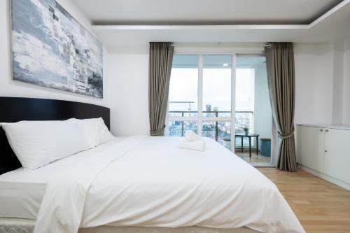 Katil atau katil-katil dalam bilik di Olympia City Residence Suite by Caerus Management