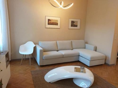 a living room with a couch and a table at Appartement The View in Dinant