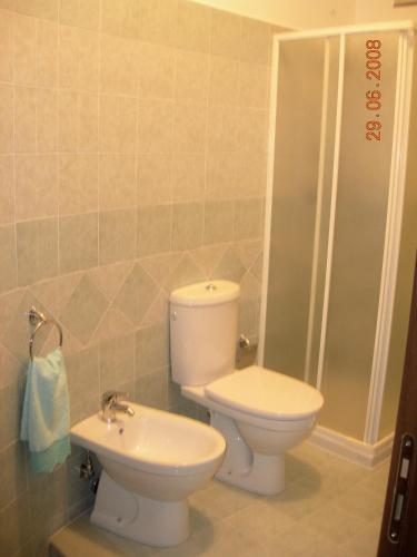 a bathroom with a toilet and a sink at La Porta Dell'Etna - Nicolosi in Nicolosi