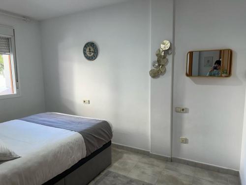 Un pat sau paturi într-o cameră la Apartamento La Timba