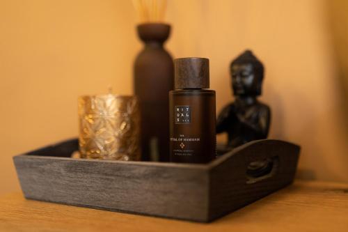 a black box with a bottle of soap and a candle at Hotel Kanajt in Punat