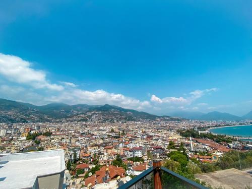 a view of a city and the ocean at Castle Light Boutique in Alanya