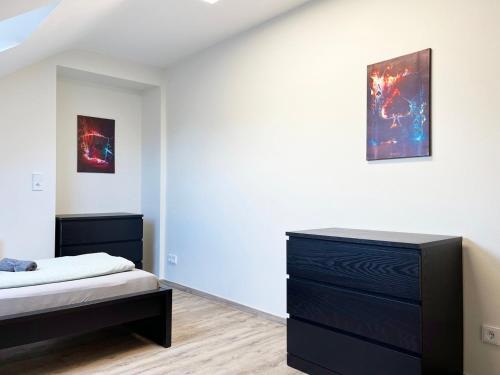 Ένα ή περισσότερα κρεβάτια σε δωμάτιο στο Geräumige Apartments mit Garten