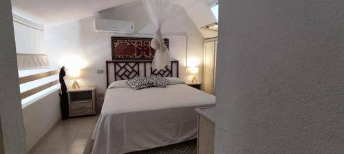 Llit o llits en una habitació de Villetta con giardino immersa nel verde a 150mt dal mare