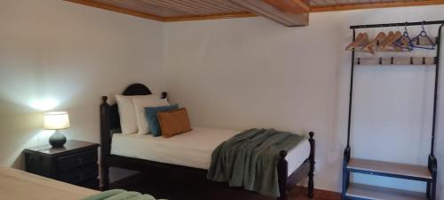 a bedroom with a bed and a bed at Casa das Vistas in Porto Moniz
