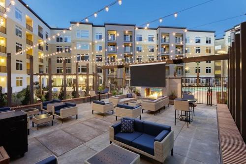 a large apartment building with a flat screen tv at Dublin 1br w parking gym ac nr shopping SFO-1460 in Dublin