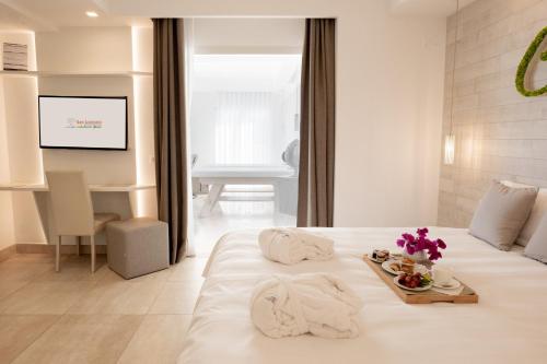 Letto o letti in una camera di San Lorenzo Boutique Hotel & SPA
