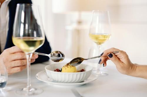 a group of people sitting at a table with wine glasses at Palácio do Visconde - The Coffee Experience in Lisbon