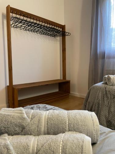 a living room with a bed and a mirror at Casa de la Mestra, Espinalbet - ALBERGA in Castellar del Riu