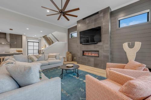 a living room with two couches and a fireplace at LBJ Bliss Retreat Heated Pool Hot Tub Game Rooms in Burnet