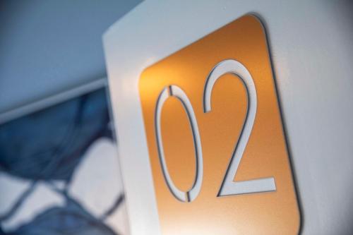 a close up of a sign with the number zero at Nightcap at Rex Hotel in Adelaide
