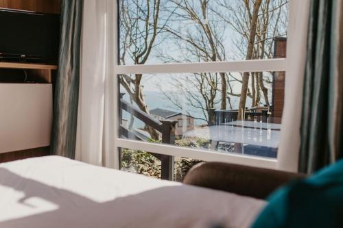 a room with a window looking out at a balcony at Studio Pod 1 in Portland